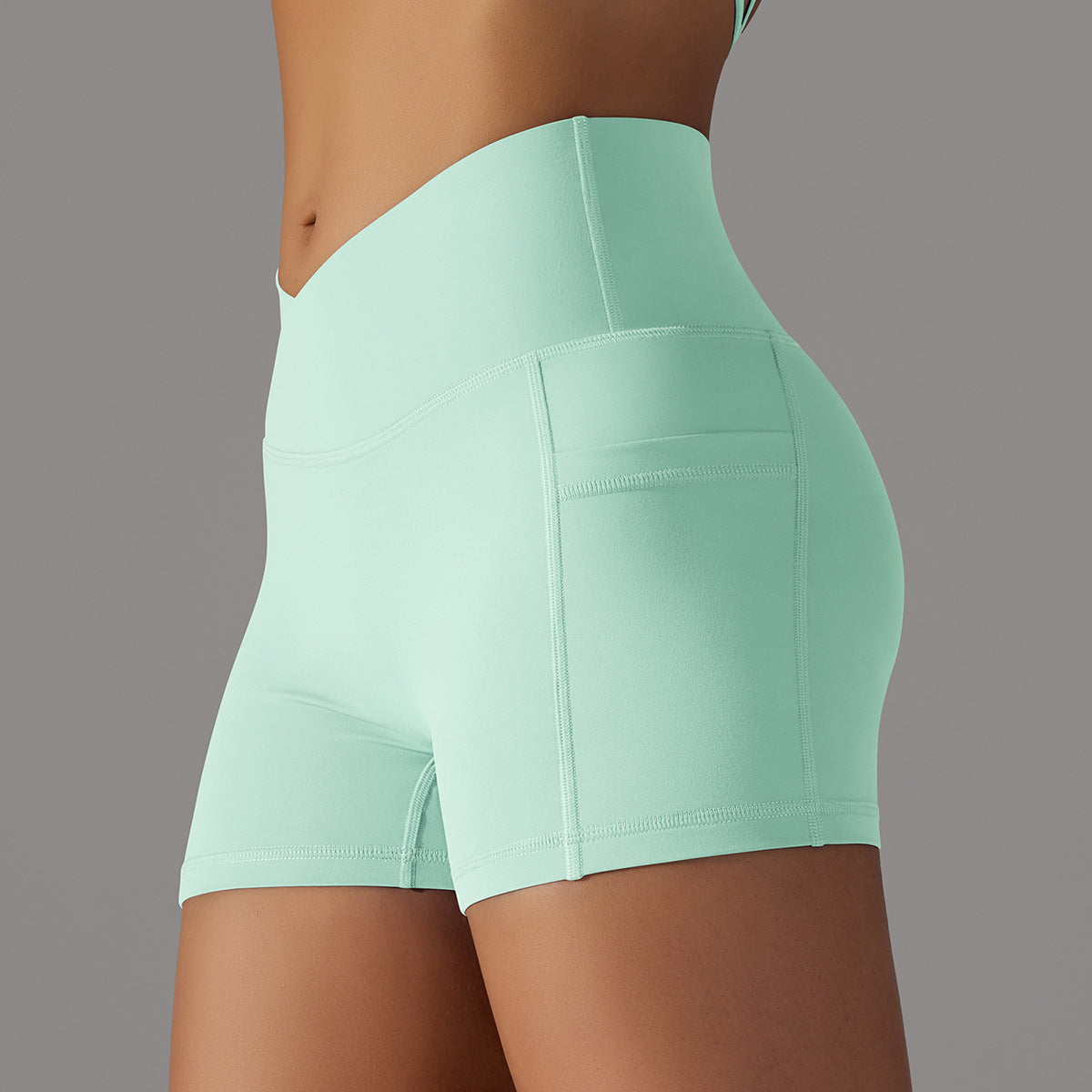 Shorts de yoga avec conception de poche de téléphone pantalons de sport pour femmes